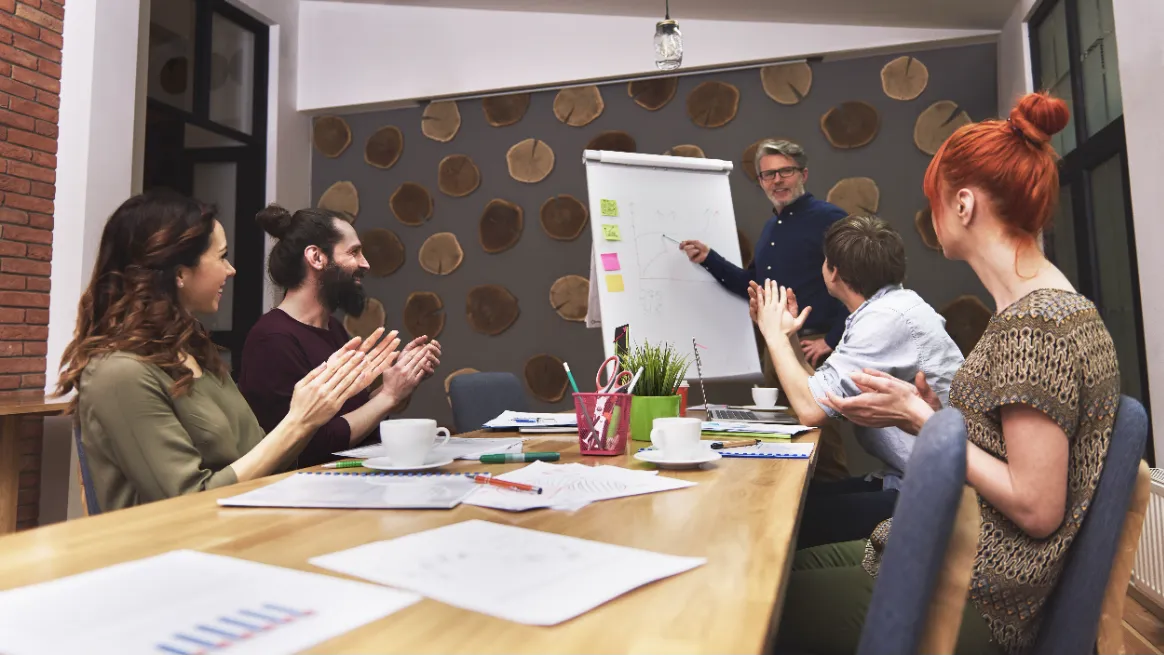 Baby gear marketing meeting with team planning promotional strategies