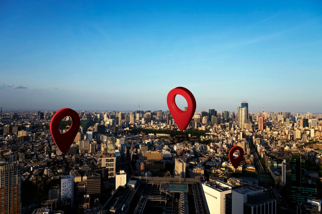 Cityscape with map pins, showcasing van rental business marketing strategy.