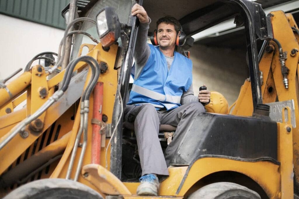 Operator using heavy machinery for equipment rentals, highlighting improved utilization through asset tracking