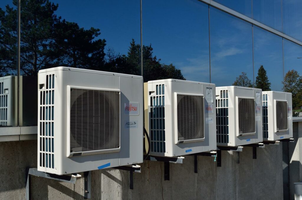 An air conditioning unit installed on an exterior wall