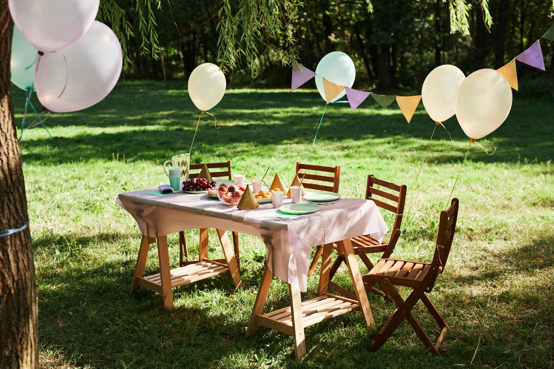 A colorful birthday yard sign display set up on a lawn