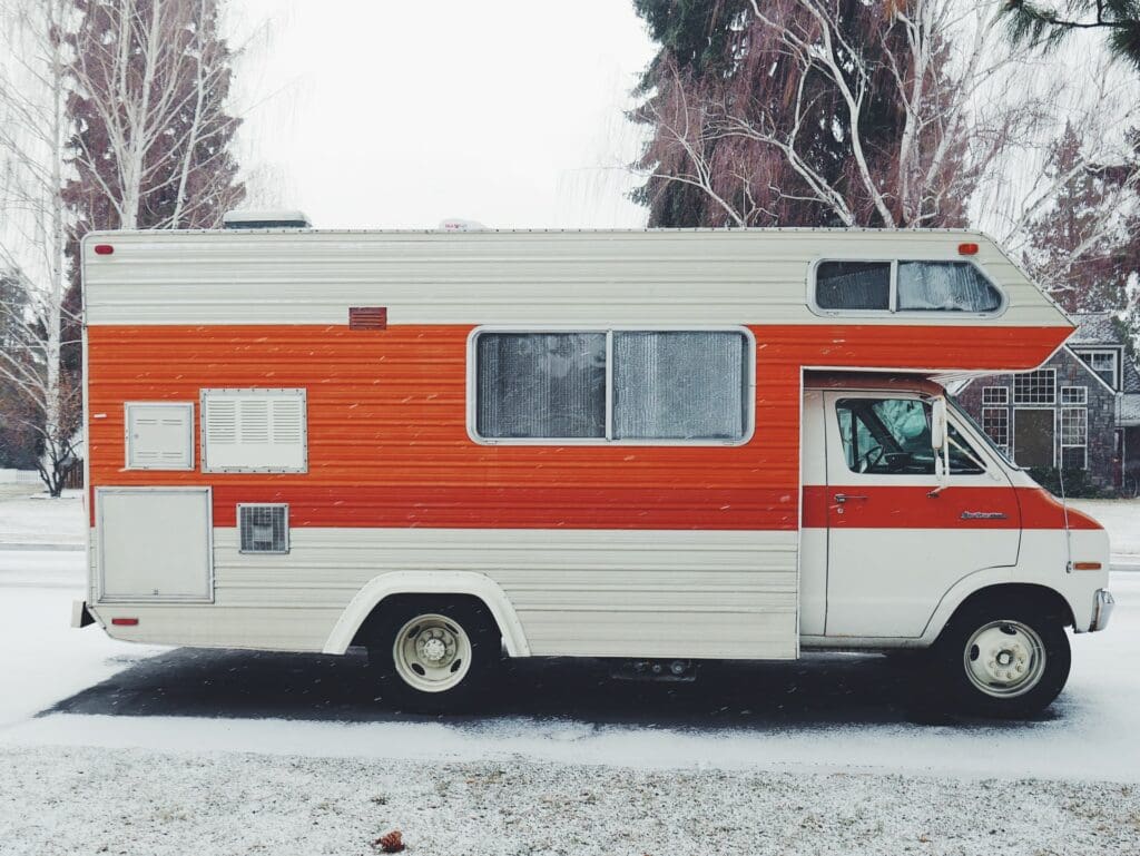 A recreational vehicle (RV) parked at a scenic campsite