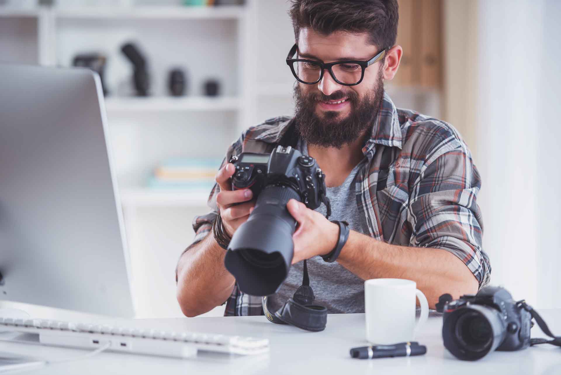 A professional photographer using rental camera equipment on a shoot