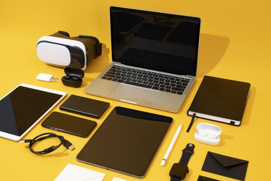 Collection of tech devices showcasing rental business growth ideas for 2025