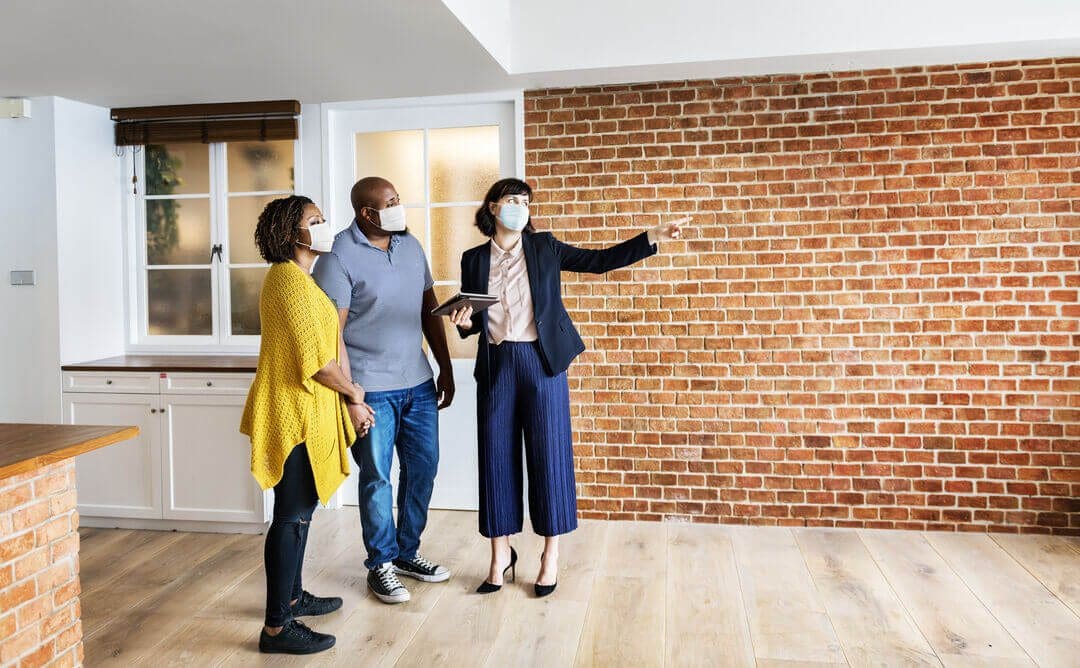 Real estate agent showing property to clients for rental business ideas