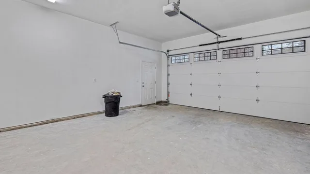 Empty white garage with windows 2023 04 27 23 03 58 utc