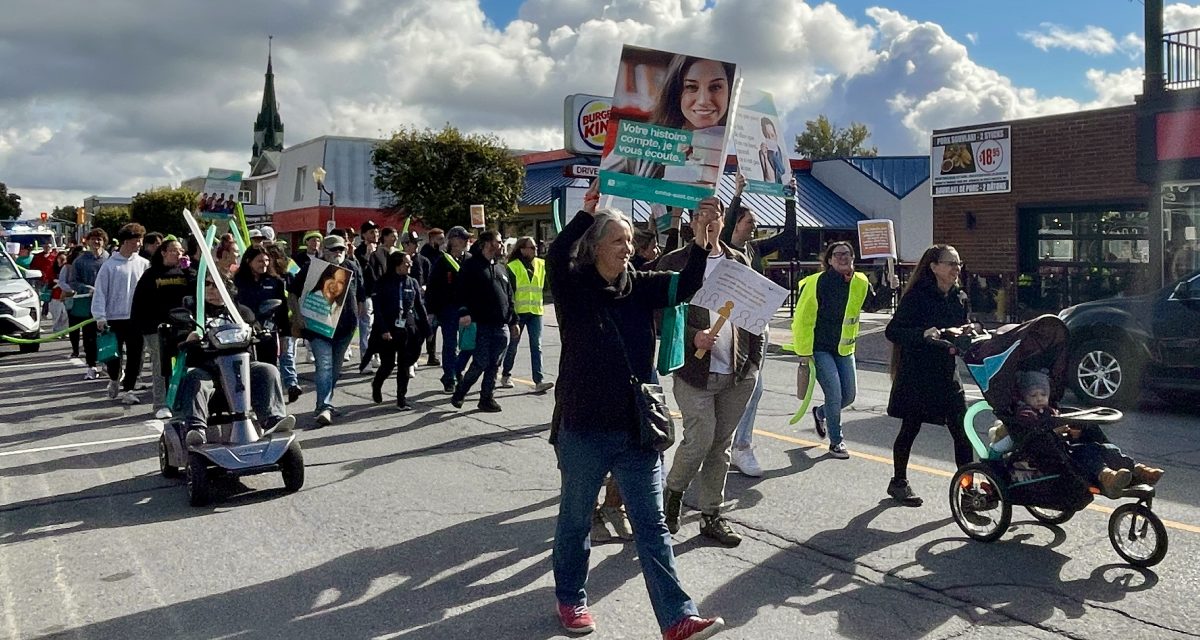 Community members and volunteers celebrate Mental Illness Awareness Week