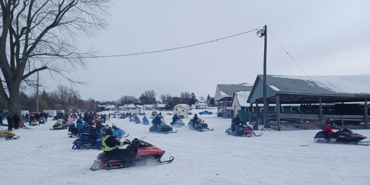 Vintage snowmobile Rally and Breakfast riding into Vankleek Hill