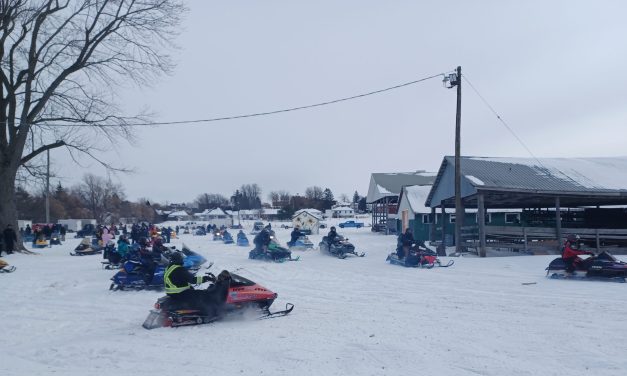 Vintage snowmobile Rally and Breakfast riding into Vankleek Hill