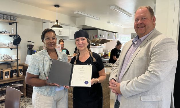 Minister presents certificate at Chute-à-Blondeau café