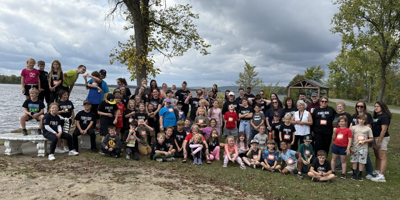 Principal puckers up for piglet in Grenville