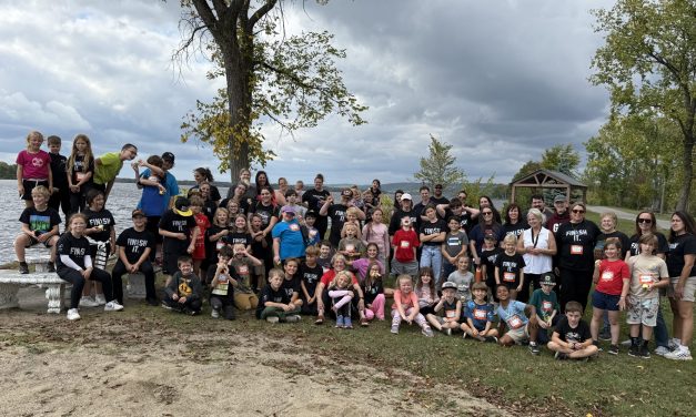 Principal puckers up for piglet in Grenville