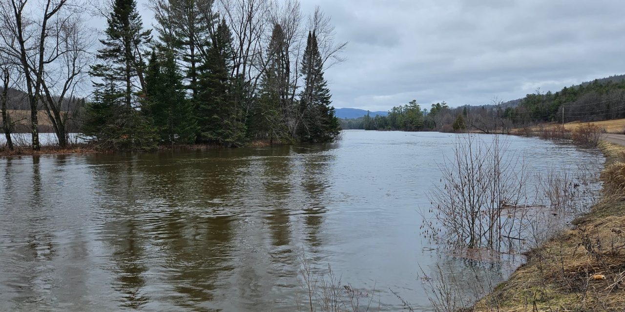 Preparing for flooding along Rivière Rouge