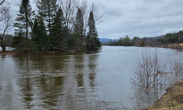 Preparing for flooding along Rivière Rouge