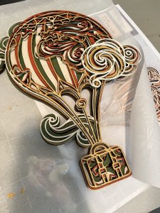 Layer Hot Air Balloon.  Made from 9 layers of individually cut and painted wood.  Perfect for nursery or child's room