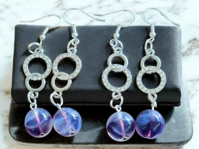 Purple marble effect cat eye glass beaded dangle earrings