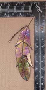 stained glass feather, this feather is made from black glass with an iridized coating on the front no light will shine through