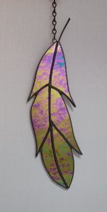 stained glass feather, this feather is made from black glass with an iridized coating on the front no light will shine through