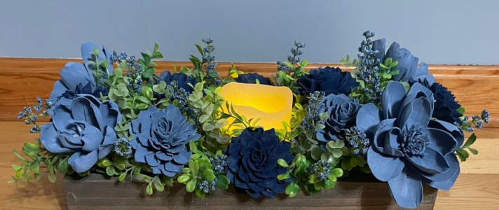 Beautiful blue candle sola wood floral arrangement