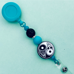 Ying Yang Skulls Badge Reel Turquoise