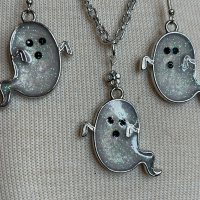 White Metallic Pearl Bezel Ghostie w/Black rhinestones @1.3"x1.2"