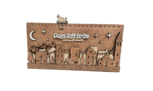 “Days left to be Naughty or Nice…” This 3D wooden village countdown is the holiday tradition you didn’t know you needed.