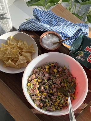 ceviche is an elite snack☺️🐟✨ recipe below! Baja-style Tuna Ceviche: Serves: 4 2 fresh tuna steaks (~300-350g) 1⁄2 cup of peeled and seeded cucumber cut in small cubes 1/2 mango finely chopped 1⁄2 cup of finely chopped cilantro 1⁄2 cup of finely chopped red onion 1 roma tomato, deseeded, finely chopped Juice of 4 limes 2 tbsp of extra virgin olive oil 1 tablespoon of aji amarillo chili paste or habanero hot sauce 1 avocado finely diced (optional) 2 tbsp soy sauce 1 tbsp of sesame oil Ground white pepper to taste Kosher salt to taste Instructions: 1. In a bowl, add tuna, lime juice, olive oil, sesame oil, yellow chili paste, and soy sauce & mix gently. Let marinate for about 5 minutes. 2. Add the mango, cilantro, red onion, cucumber, tomatoes, kosher salt and ground white pepper. Mix gently and let marinate for an additional 5 minutes. Place in the refrigerator until chilled. Serve with tortilla chips & enjoy! Knives/Cutting board: @HexClad