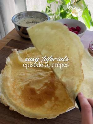 easy tutorials! episode 5: crêpes!🥞✨ Makes: 5-6 crepes Ingredients: - 1 1/2 cups milk (you can use 2% or 1%) - 2 eggs - 1 tsp vanilla - 2 tbsp sugar - 1 tbsp neutral oil - Pinch of salt - 1 cup all-purpose flour Instructions: 1. Add all the ingredients to the blender, ensuring the flour is last. Blend for 15-20 seconds or until completely smooth. 2. Preheat a large crepe pan on medium/medium-low heat for about 2-3 minutes. Have a small bowl of neutral oil and a few pads of butter ready, and brush a little oil and add a pad of butter. 3. Depending on the size of your pan and the desired thickness of your crepes, add about 1/2 cup of batter to your pan, and move your pan around as you add your batter to spread evenly. Add any extra batter to bare spots. 4. Let cook for 2-3 minutes or until the outer edges start turning light brown. Using a fish spatula or any thin spatula, lightly remove the edges from the pan. If it starts to rip, let it cook an extra 30 seconds to a minute. 5. Lightly place your spatula under half the crepe and flip. Allow the crepe to cook for another 30 seconds before removing. Repeat the process with the rest of the crepes. Serve with desired fillings! Crepe pan/Mixing bowls/Cutting board: @HexClad Blender: @Vitamix