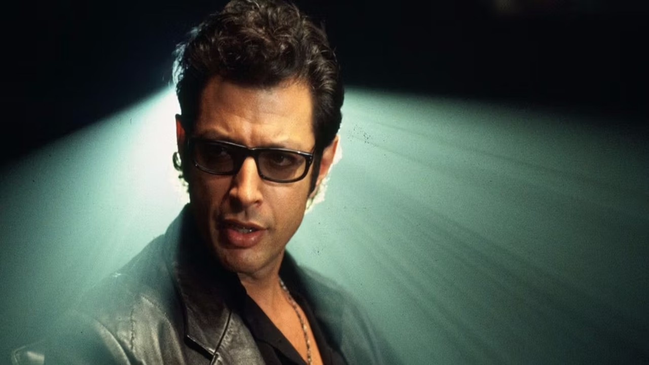 Por que o personagem de Jeff Goldblum não estava no roteiro original?