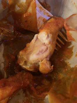 Consumer Food Safety Report BrewDog, Via Faenza, 21r, 50123 Firenze, FI, Italy An undercooked chicken wing that has been refused... photo #1