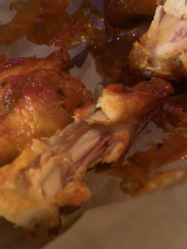 Consumer Food Safety Report BrewDog, Via Faenza, 21r, 50123 Firenze, FI, Italy An undercooked chicken wing that has been refused... photo #3