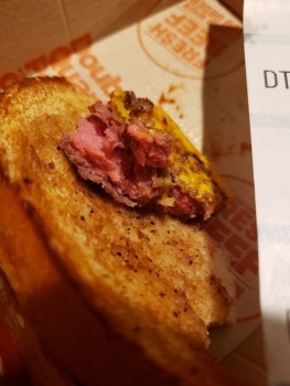 Consumer Food Safety Report McDonald's this burger undercooked (or even cooked at all)? One bite see (pic) and had to throw away... photo #2