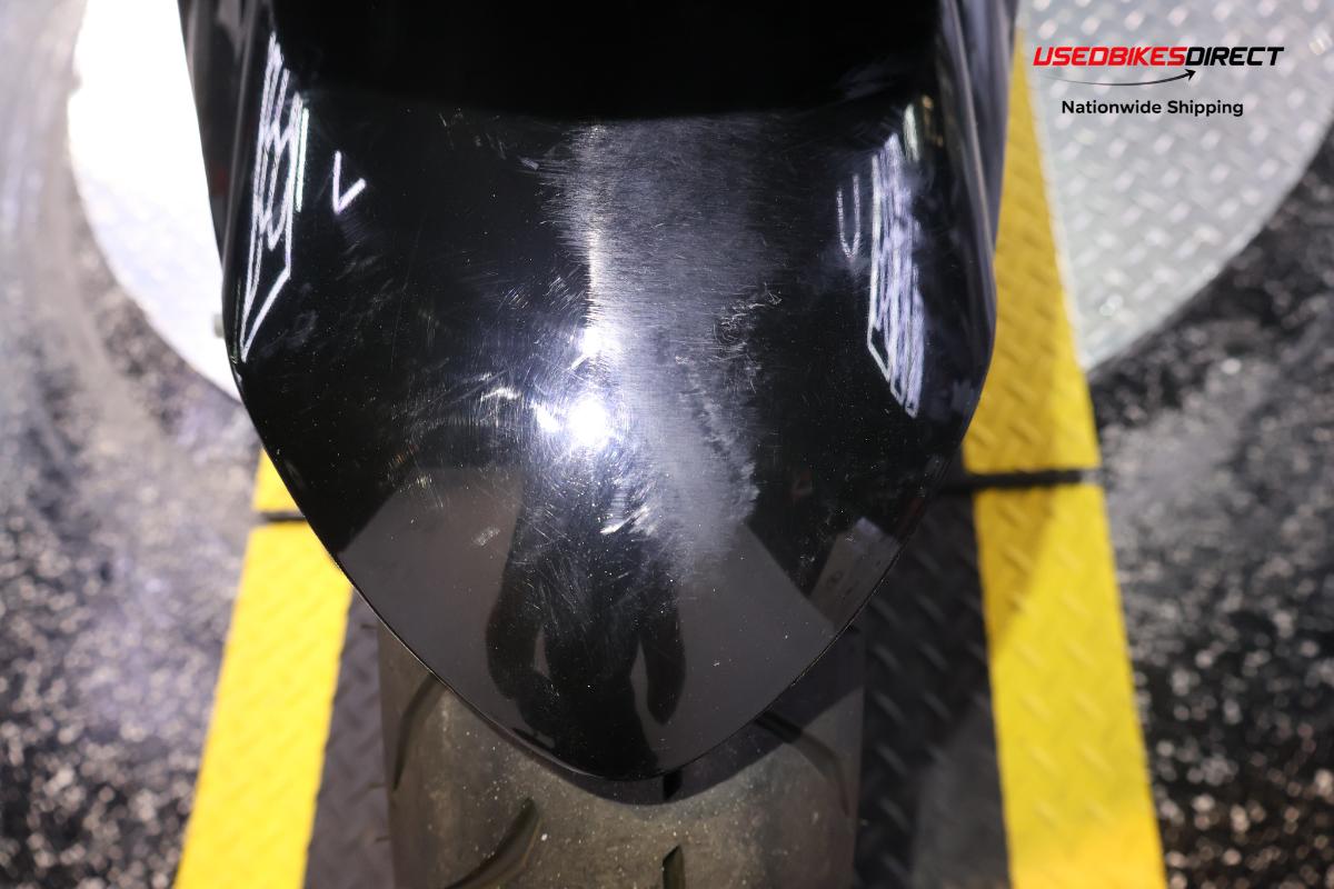 rear seat wear, road rash on side faring and cover, scratches on front wheel faring