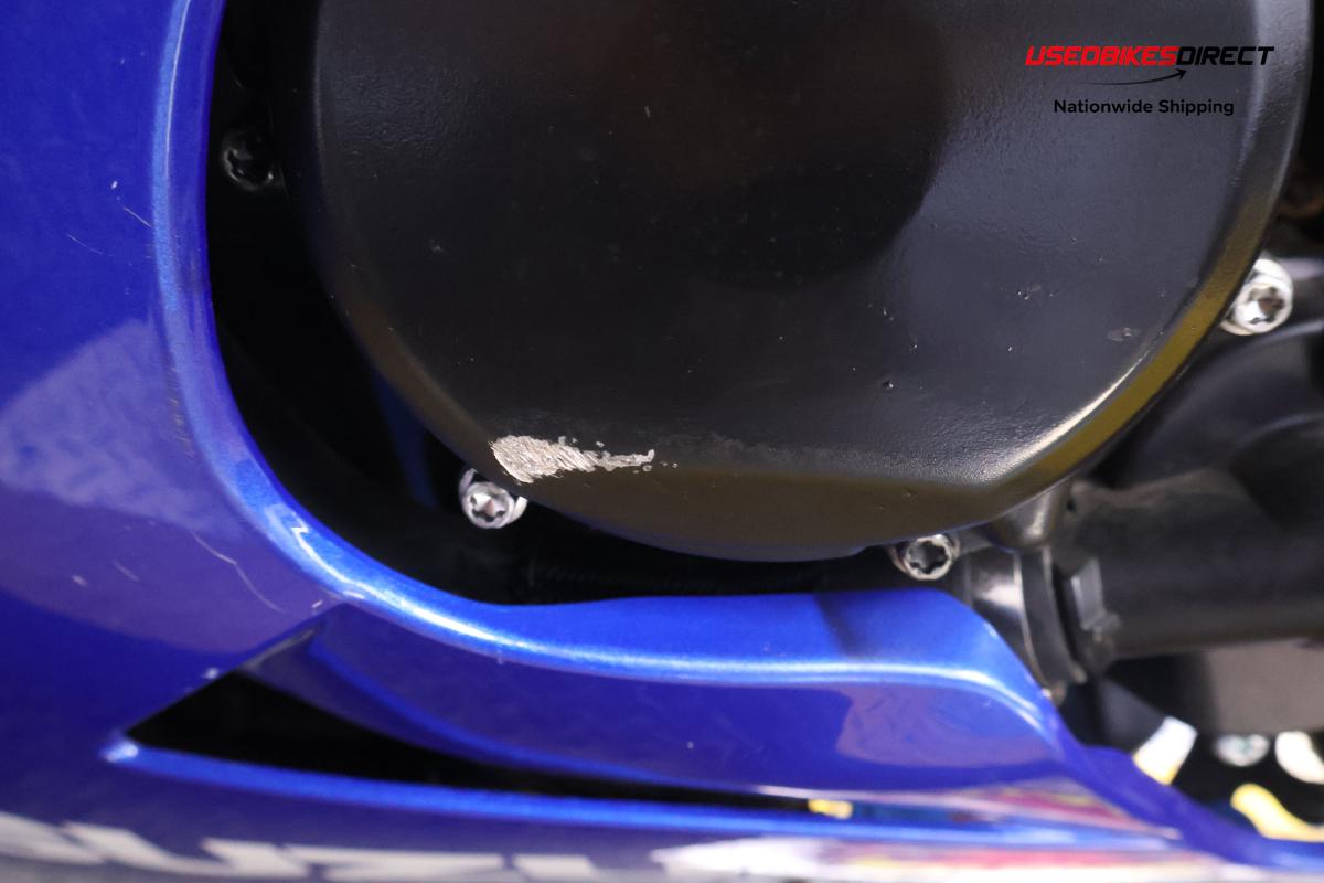 rear seat wear, road rash on side faring and cover, scratches on front wheel faring