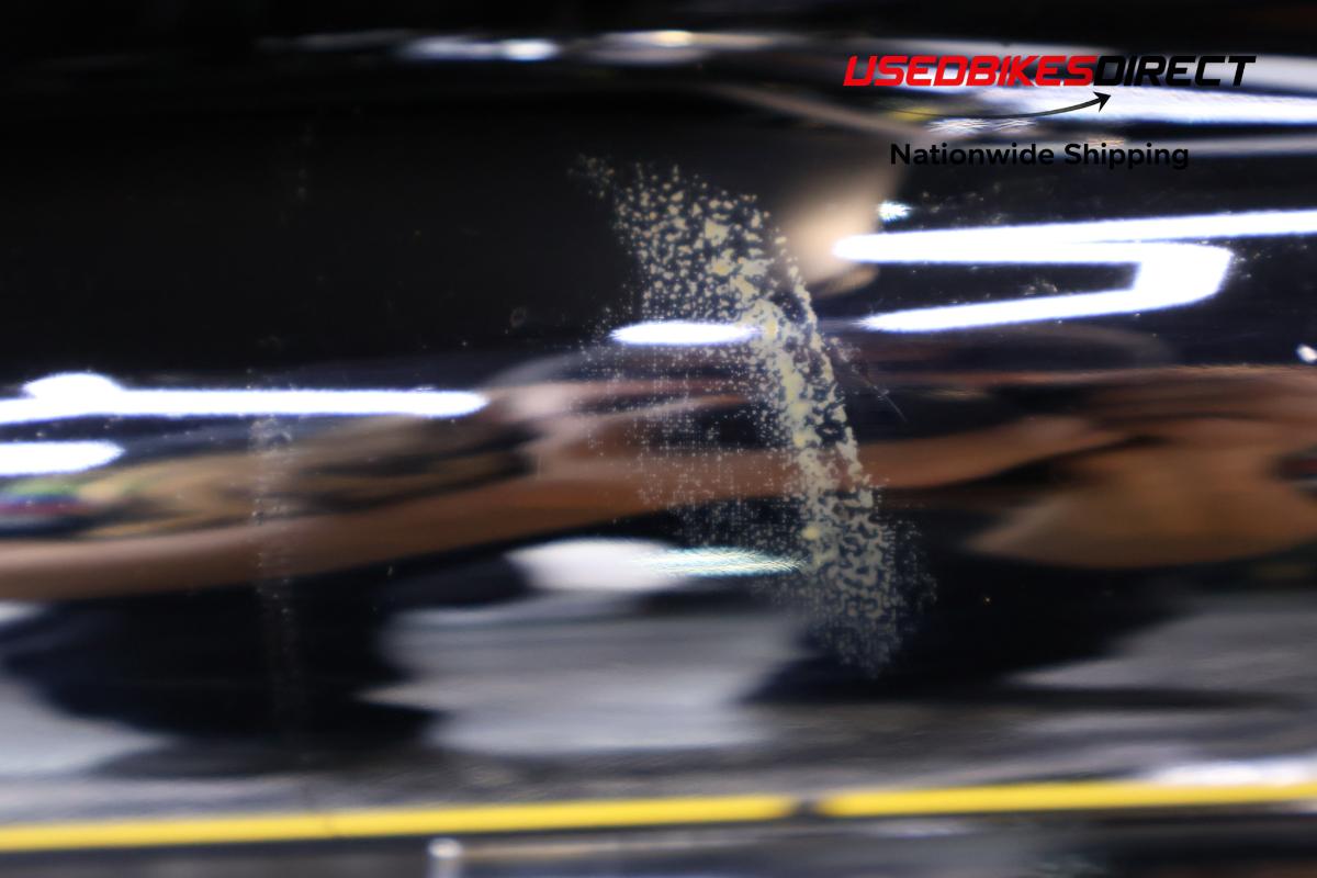 scratches on front fender and burn mark on exhaust