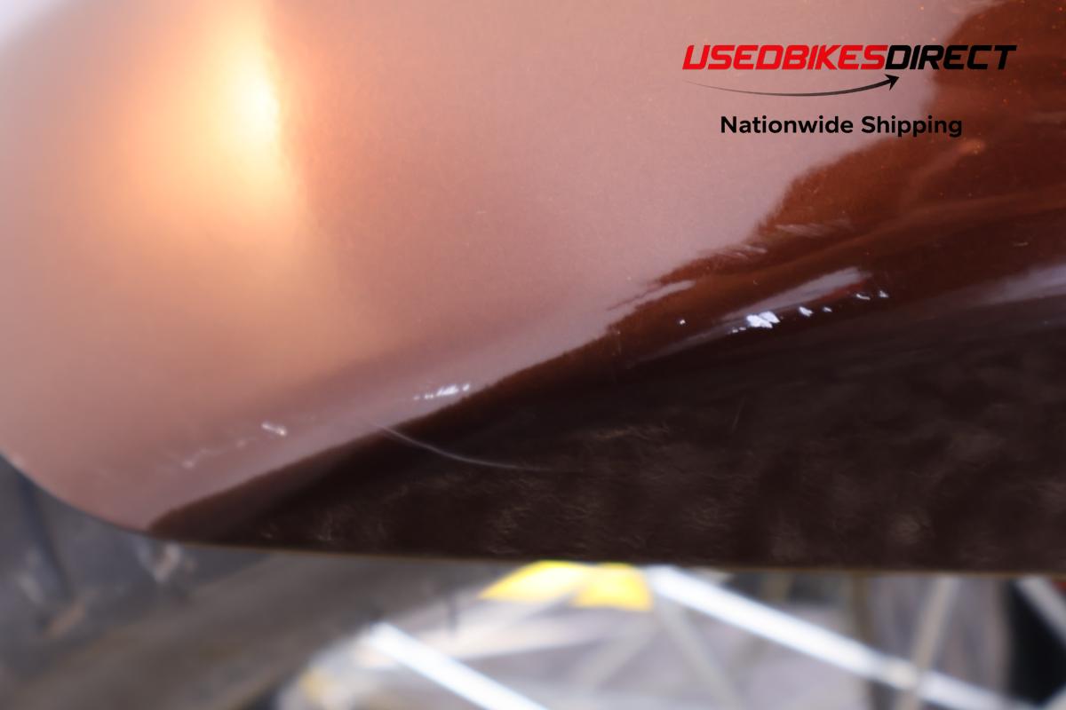 scratches on front fender and burn mark on exhaust