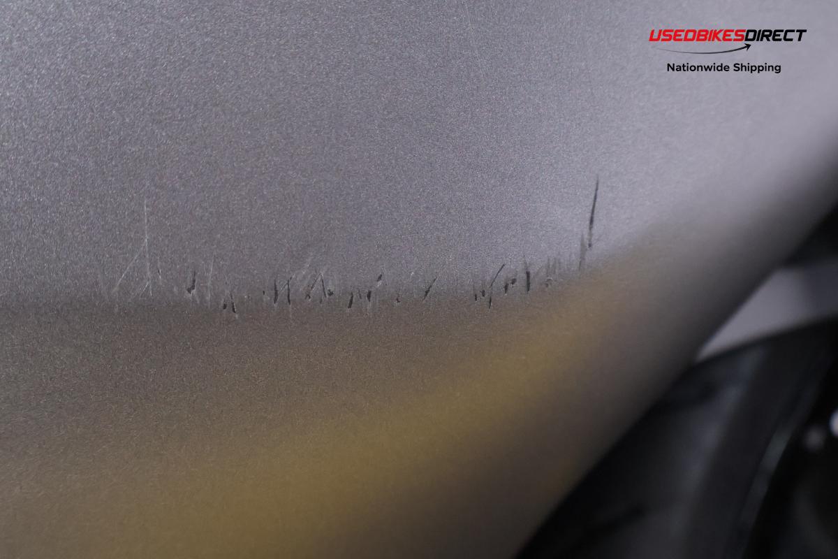 Bent rim on rear, road rash on mirrors and faring
