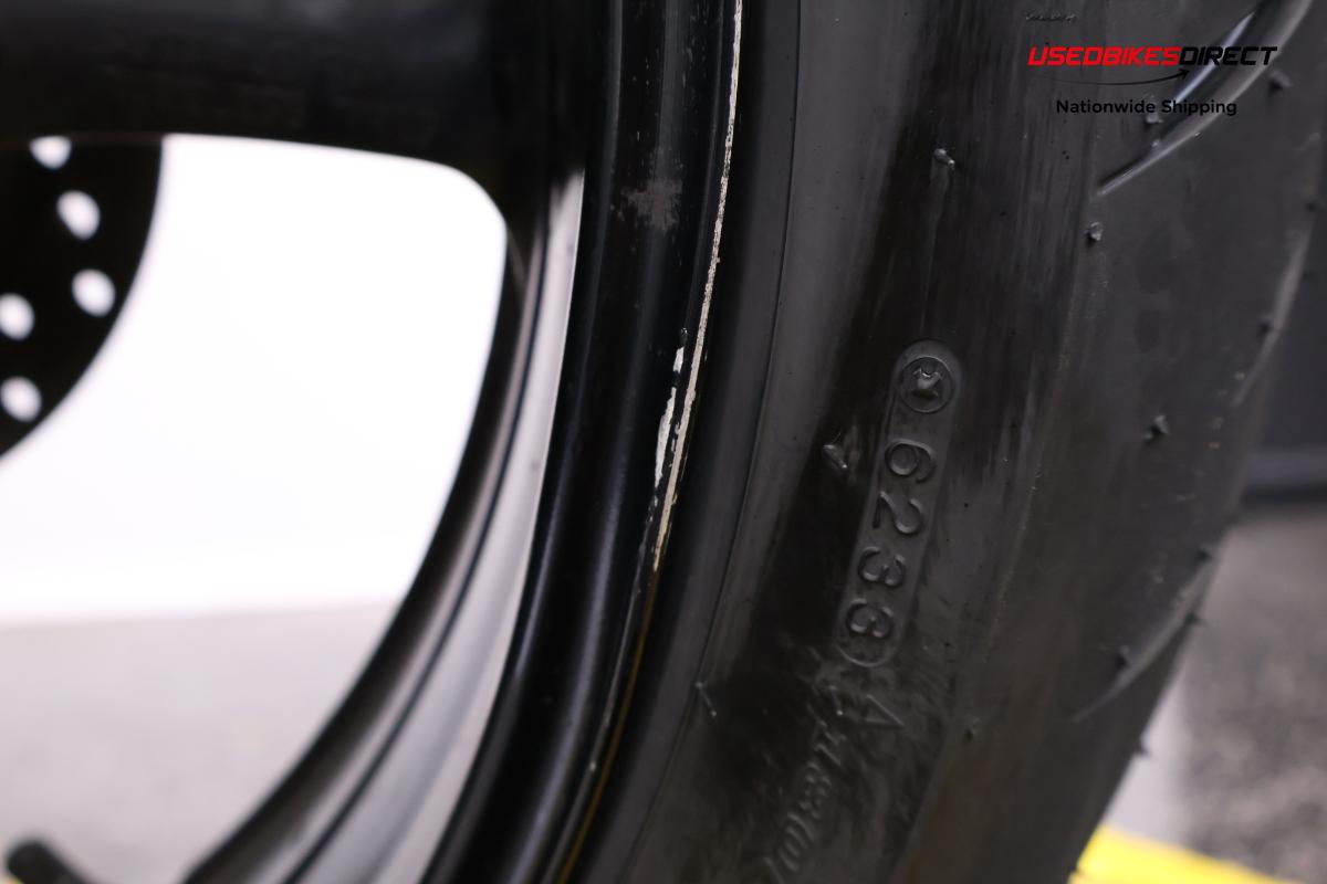 Bent rim on rear, road rash on mirrors and faring
