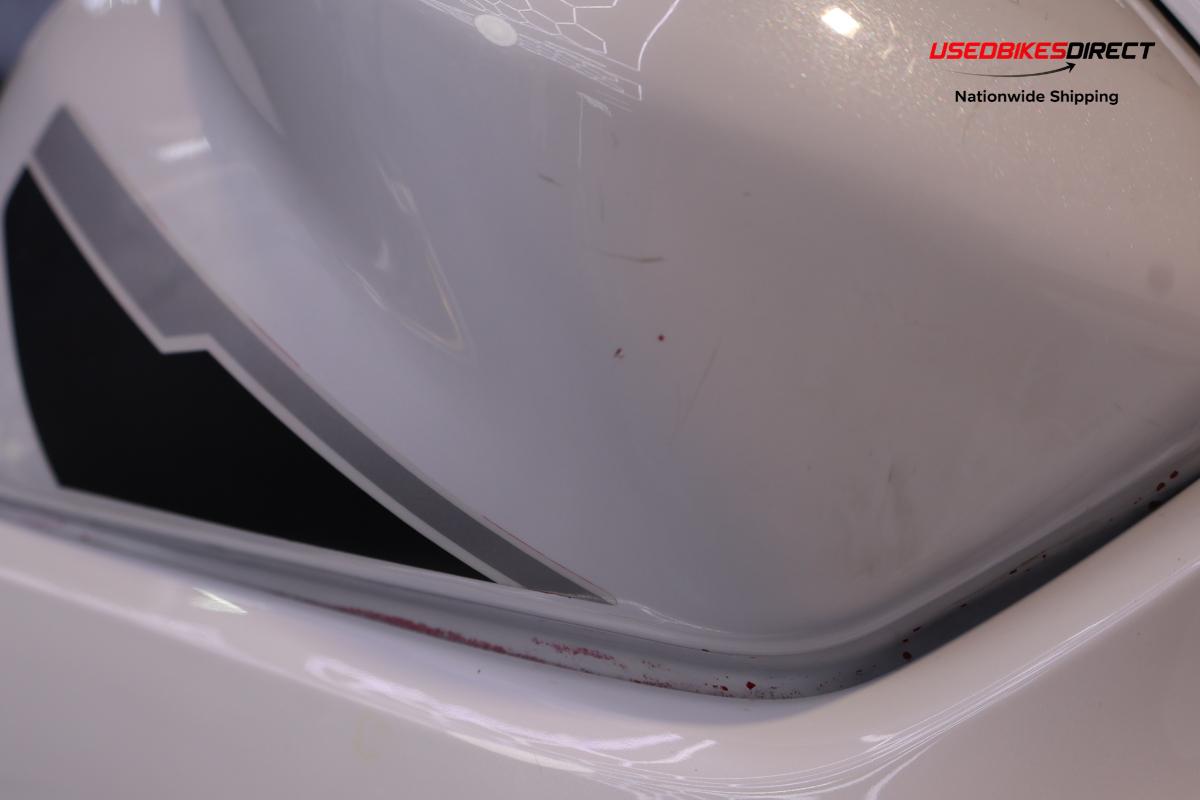 road rash on faring pieces, sliders, levers and front cowl, red paint on faring pieces.