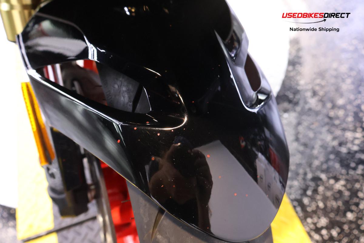 road rash on faring pieces, sliders, levers and front cowl, red paint on faring pieces.