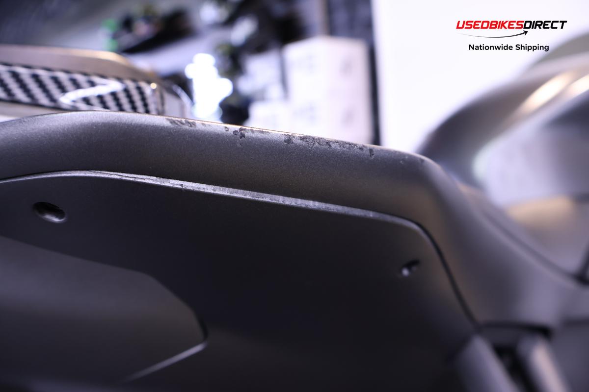 road rash on exhaust, road rash on rear tail, paint chip on side faring