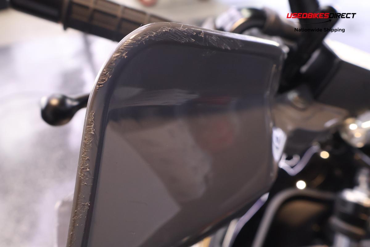 road rash on side mirror, minor scratches on faring.