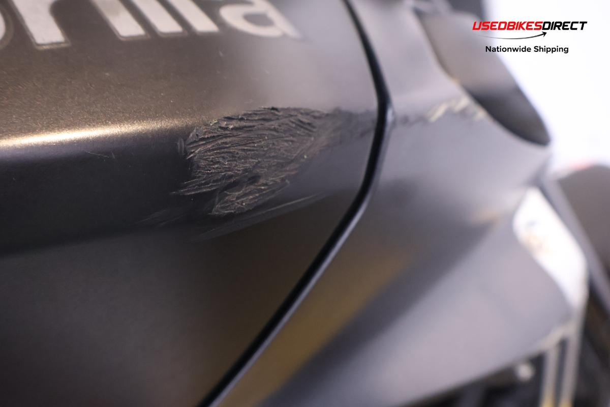 road rash on faring and rear peg, road rash on front guard, glue on turn signal