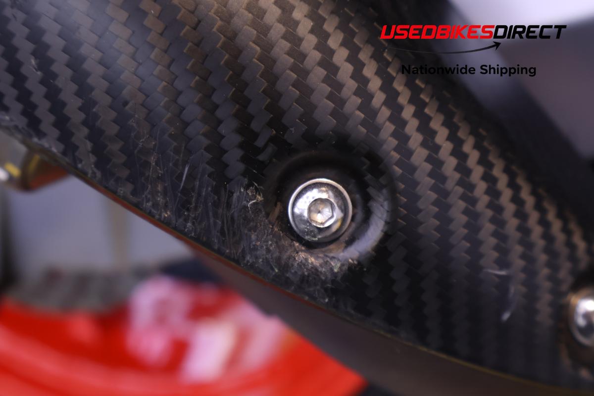 paint chips on faring pieces , road rash on exhaust cover