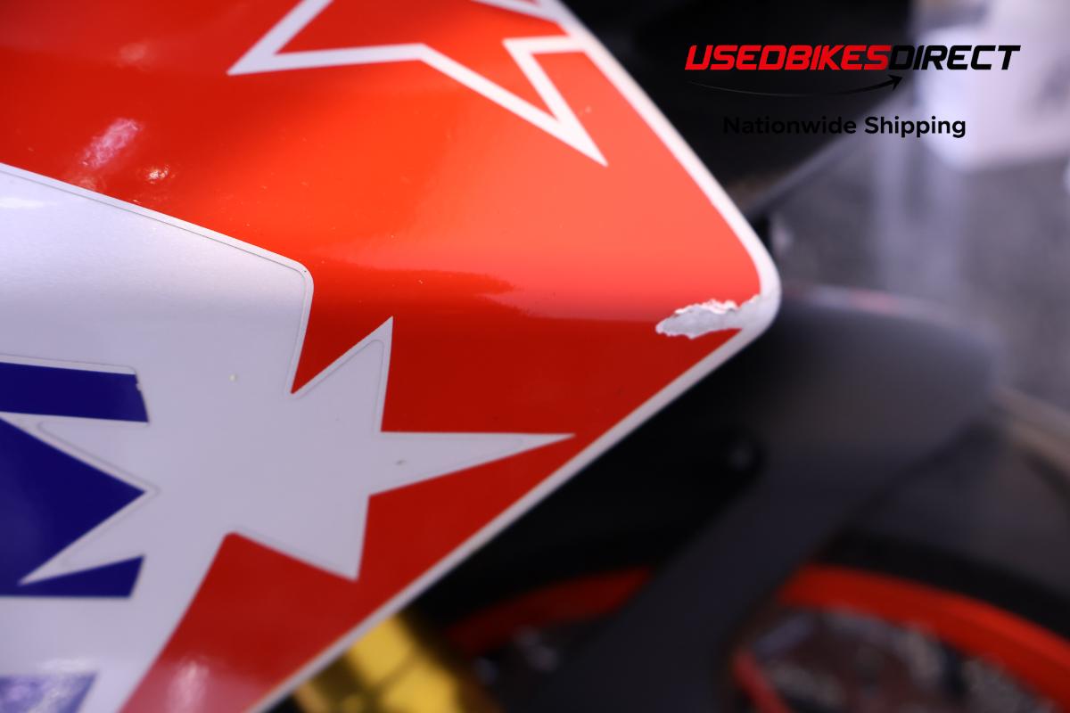 paint chips on faring pieces , road rash on exhaust cover