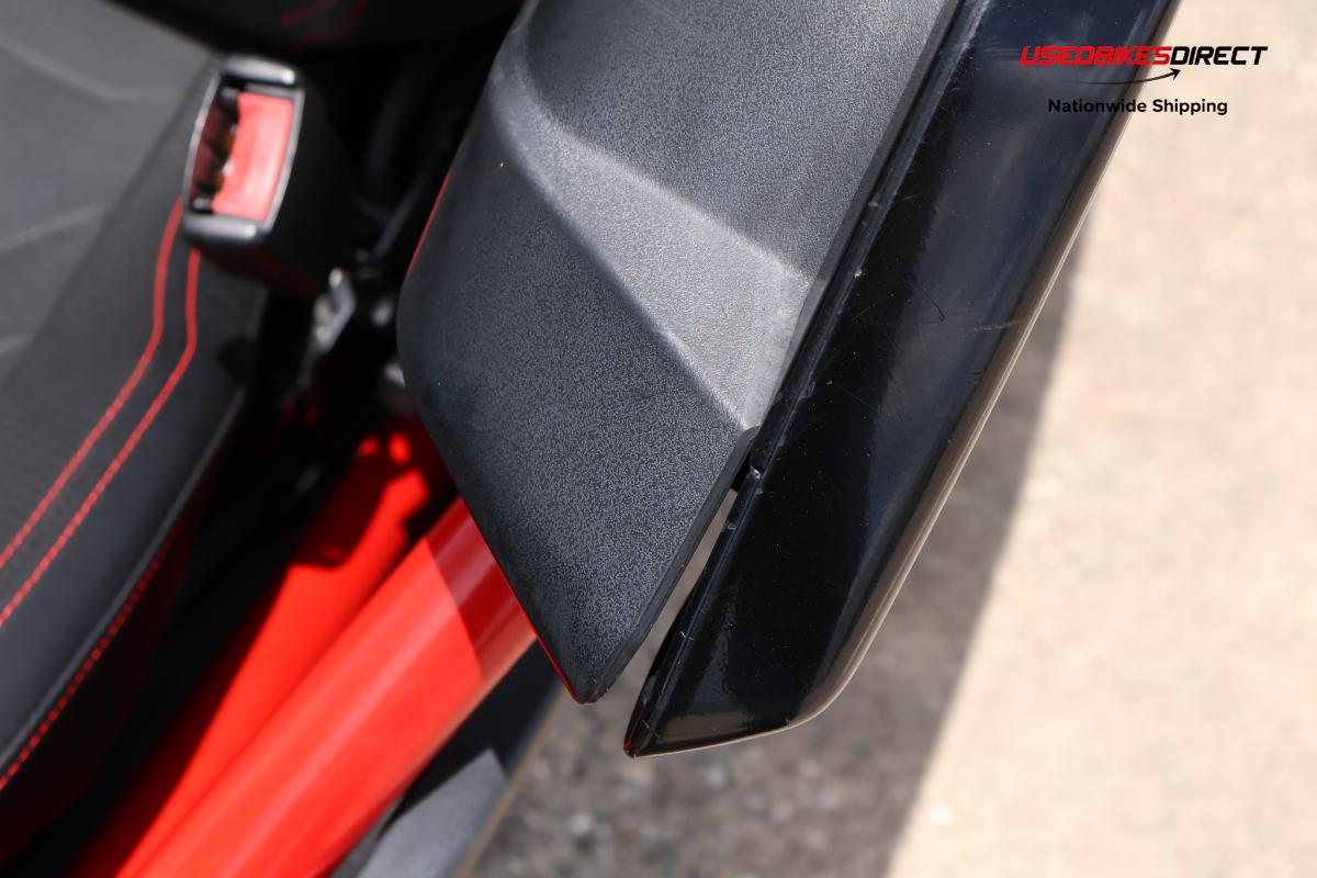 decals peeling off, cracks on bumper, damage to front bumper, road rash on side marker