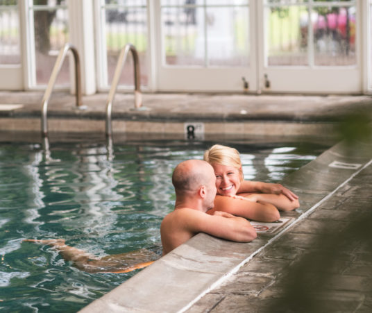 Couple in pool at The Martha spa