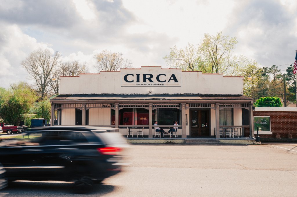 A blurred car drives past the Circa restaurant in Thompson's Station in Williamson County, Tennessee.