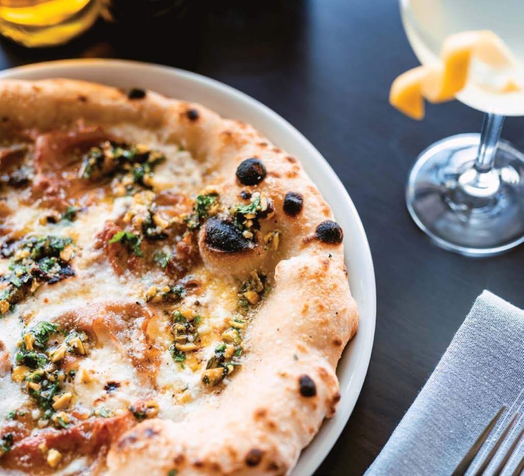 pizza and cocktail on restaurant table