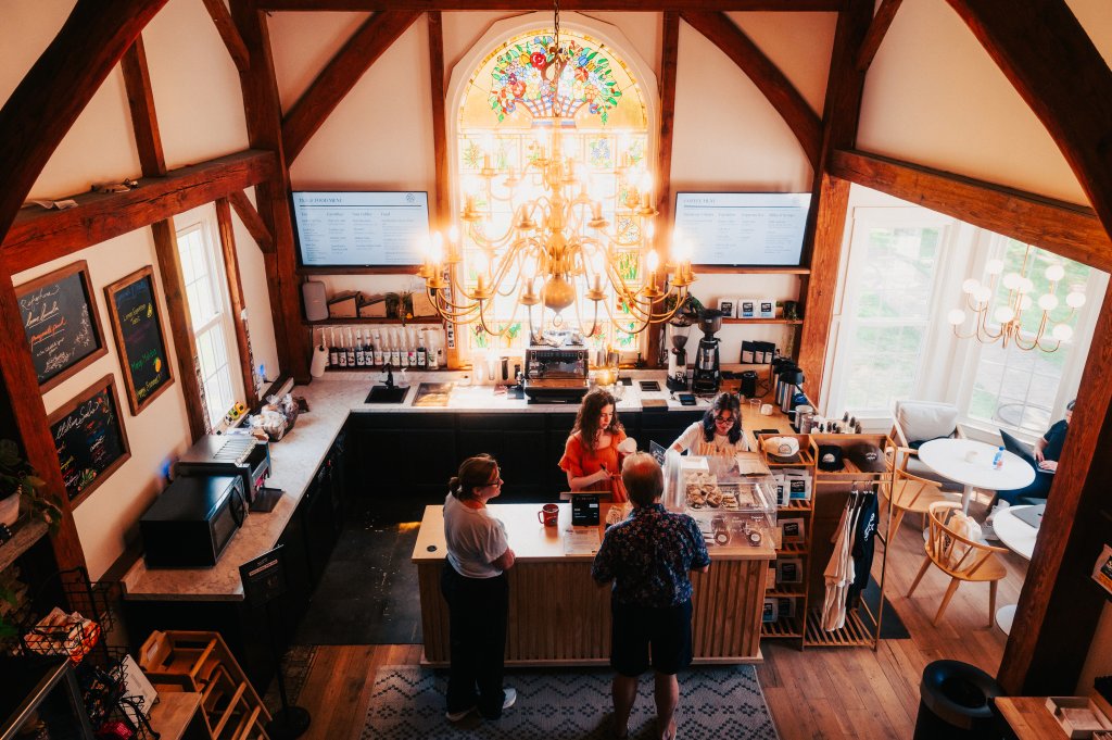 Your Guide to Discovering the Best of Spring Hill, Tennessee A high-angle view of a cozy coffee shop with a large stained glass window in Williamson County, Tennessee.